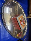 A silver plated serving tray and a biscuit tin