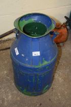 A blue painted milk churn