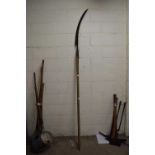 An extra long handle sickle