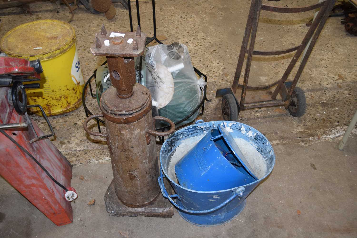 A vintage car jack together with a galvanised bucket