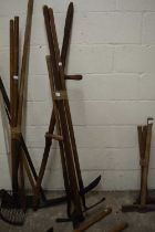 Bundle of various tools to include a scythe, various hoe's etc