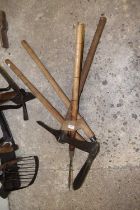 Bundle of implements to include edging shears, pick axe etc