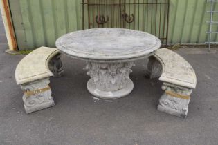 Large decorative composite garden table together with two curved composite benches