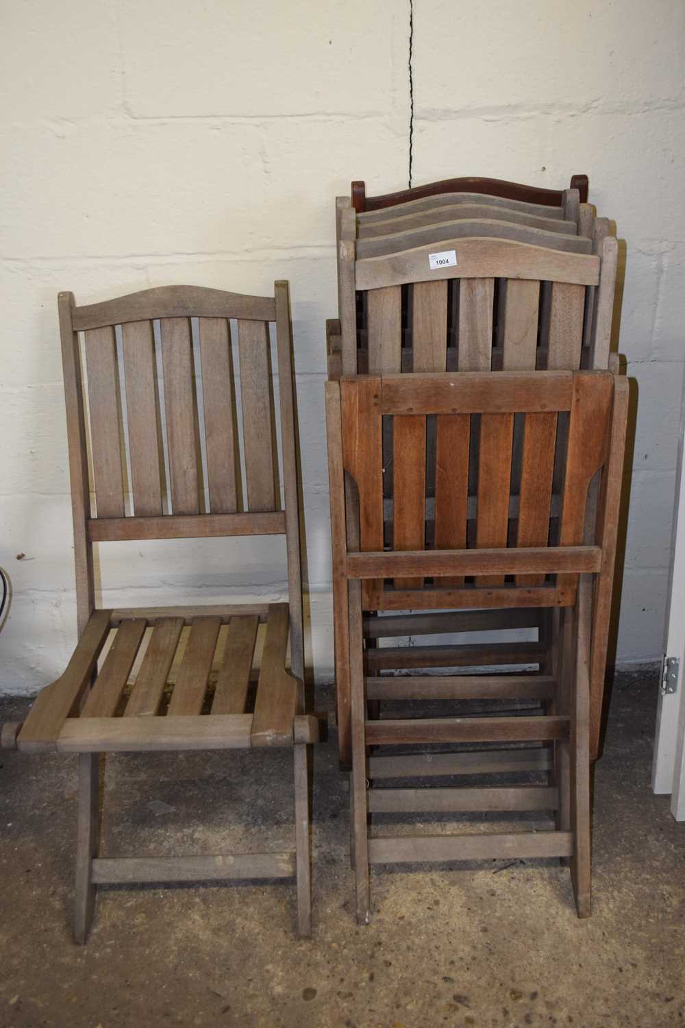 Six teak garden chairs