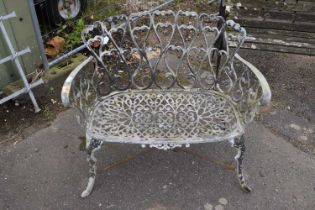 A decorative cast garden bench