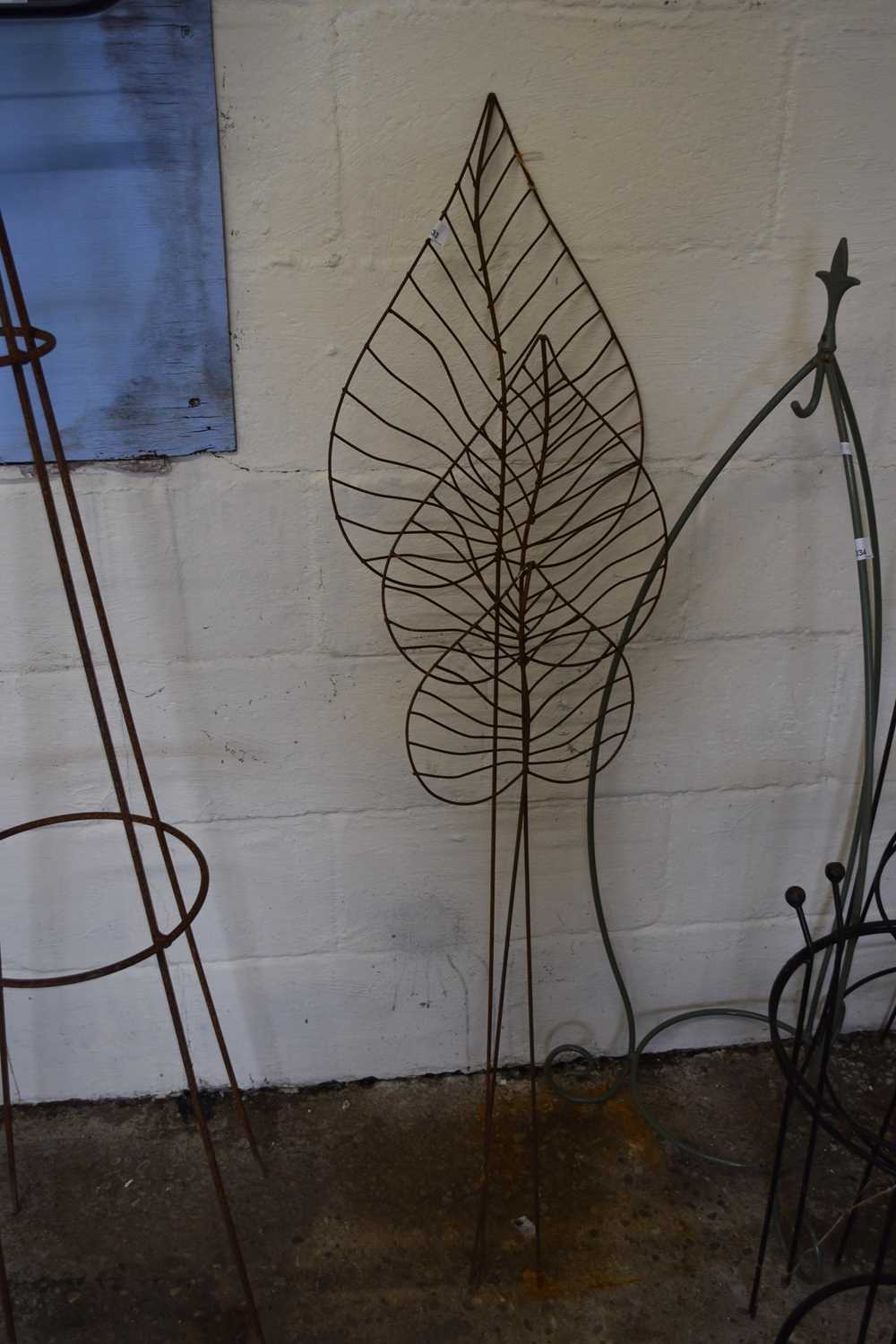 Three metal leaf sculptures