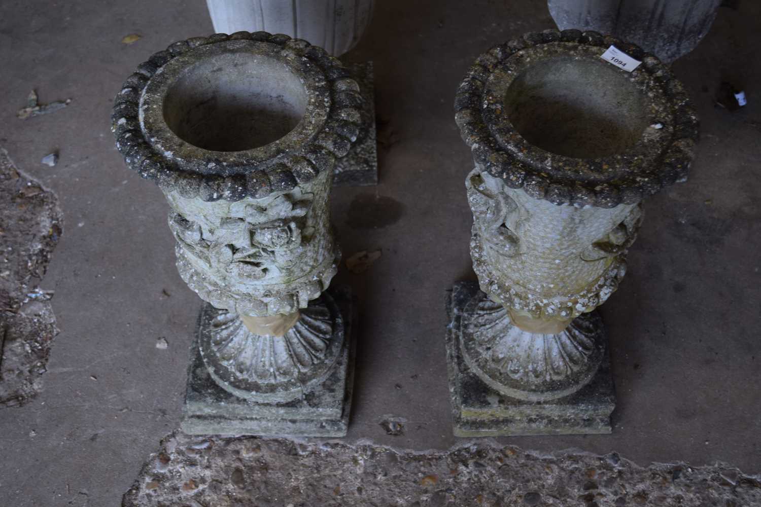 Two composite garden urns/planters