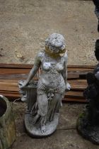 Composite garden statue of a lady