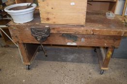 A heavy duty work bench with a record vice