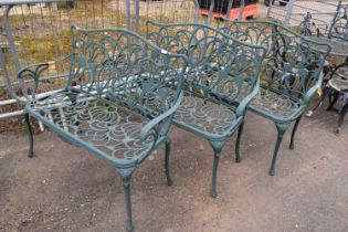 Three matching cast metal garden benches