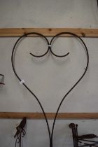 An iron garden sculpture in the shape of a heart
