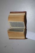 A miniature Holy Bible with Old and New Testaments, leather bound