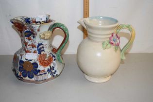 A Masons iron stone jug together with a Clarice Cliff Newport Pottery jug with floral handle