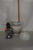 Chrome based oil lamp together with a white glazed jug