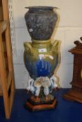 A reproduction Maiolica style pottery vase with swan shaped supports together with a silver plated