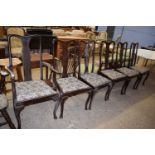 A set of seven Queen Anne style dining chairs