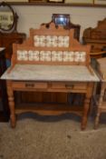 A Victorian marble top and tile back wash stand