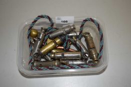 Box of various assorted whistles