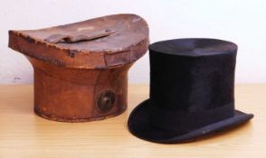 A top hat and leather case, the top hat by Herbert Johnson, Bond Street, London, approx. 53cm