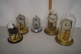 A group of five various dome topped tortion anniversary type clocks