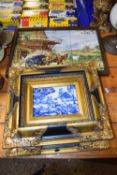 A pair of reproduction iron stone plaques set in gilt frames together with a further tile work