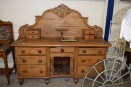 A large Victorian pine sideboard with arched back