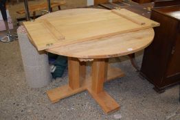 Modern light oak pedestal extending dining table