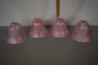 A set of four 20th Century pink lustre finish glass light shades