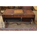 A Georgian rose wood and brass inlaid sofa table with reversible games centre section, sold for