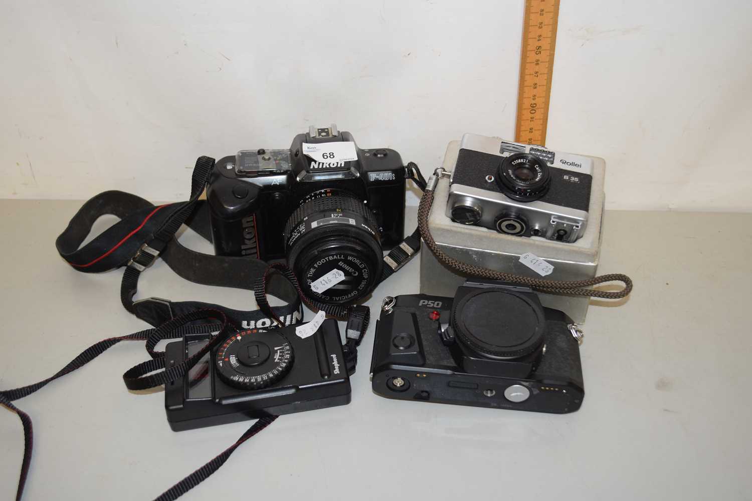 Mixed Lot: Assorted cameras to include Nikon F-401S, Pentax P50, Rollie B35 and a further flash