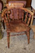 A bow back captains type chair