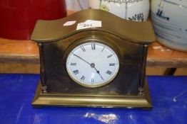 A brass cased mantel clock