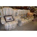 Striped upholstered three seater sofa with matching armchair and footstool