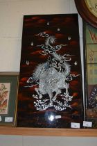 Modern Chinese mother of pearl lacquered panel depicting a dragon