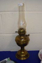 A brass based oil lamp