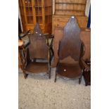 A pair of oak throne style chairs in the style of Jack Grimble