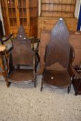 A pair of oak throne style chairs in the style of Jack Grimble