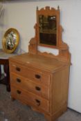 A late Victorian pine three drawer dressing chest