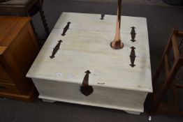 A painted hardwood storage coffee table