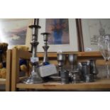 Collection of various pewter candlesticks, goblets etc