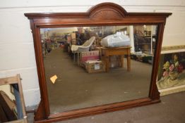 A late Victorian over mantel mirror with carved frame