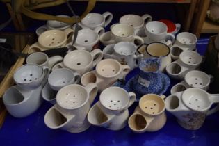 A quantity of various shaving mugs