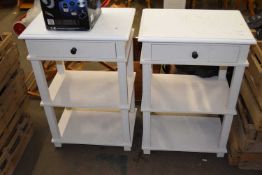 A pair of three tier single drawer night stands