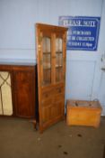 A reproduction oak corner display cabinet with lead glazed top section