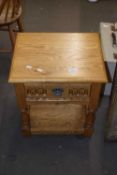 A small oak bedside or lamp table