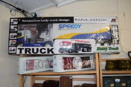 A radio control streamline body heavy truck together with two modern collectors dolls (3)