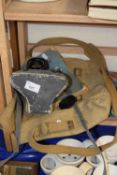 A Pentax K1000 camera together with an Austin Mini Drivers Handbook and a vintage army canvas bag