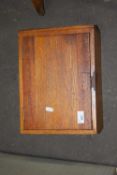 A small oak single door cabinet