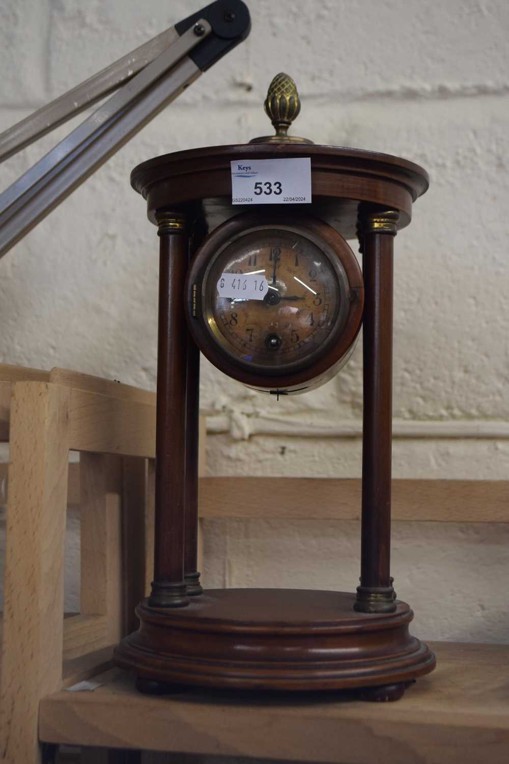 An early 20th Century hardwood cased portico type continental mantel clock