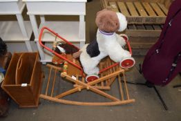 Push along toy dog and a child's rocking horse chair